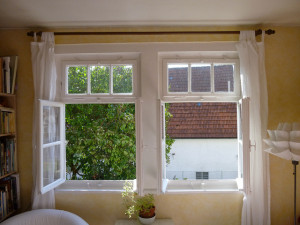 open windows overlooking tiled roof